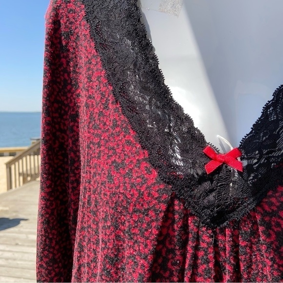 It’s red and black top has a Lovely lace V-neck with a little red bow. So soft! - Picture 2 of 5